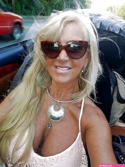 Tan GILF with amazing deep cleavage