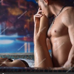 Young beautiful couple relaxing in swimming pool Stock Photo Wisky 335802472