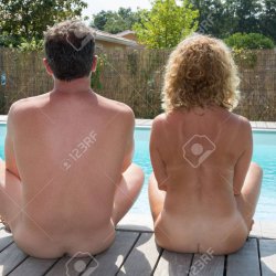 Relaxing Nudist Couple Sitting On The Swimming Pool At Summer Stock Photo Picture and Royalty Free Image. Image 62330295.
