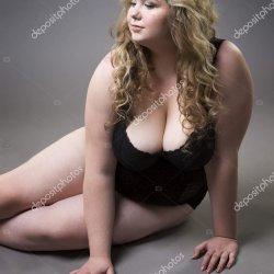 Young beautiful blonde plus size model with big natural breasts in underwear xxl woman on gray studio background Stock Photo starast 143084407